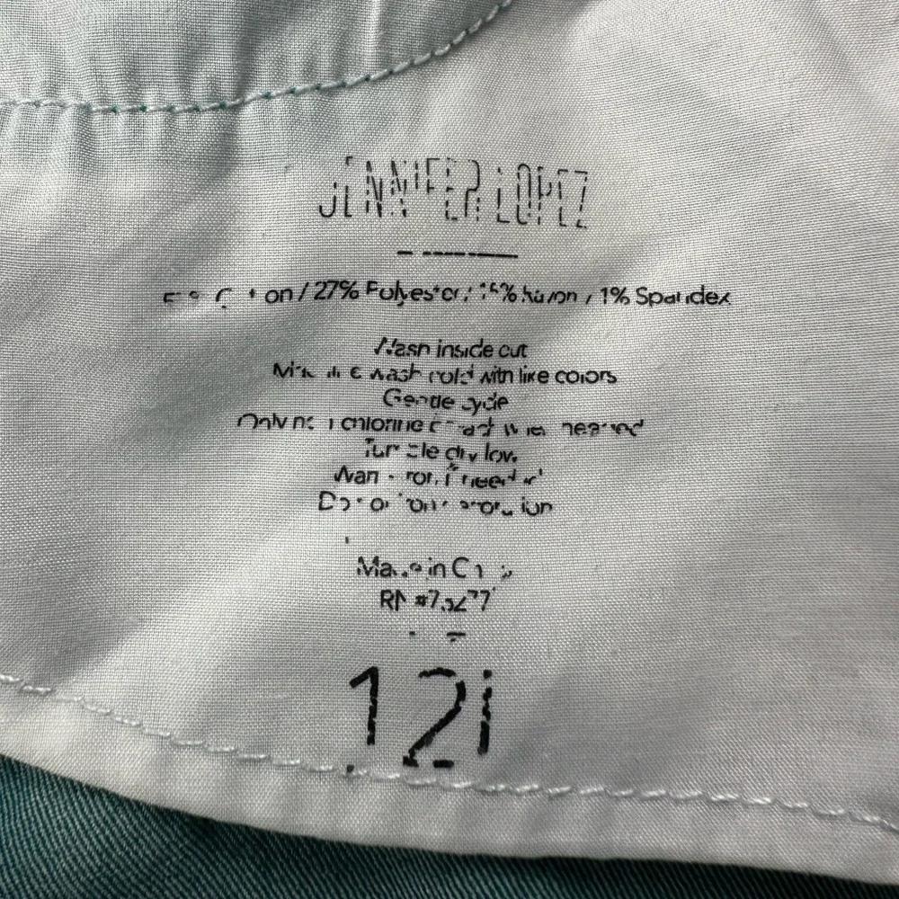 JLo straight jeans. Stretchy. Teal with zipper at ankle. Size 12